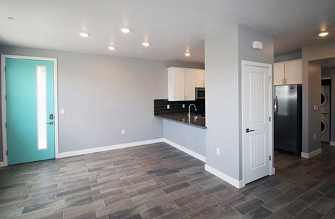 Pet-Friendly Apartments in Reno, NV - Dining Room with Kitchen Bar, Overhead Lighting, and Front Door